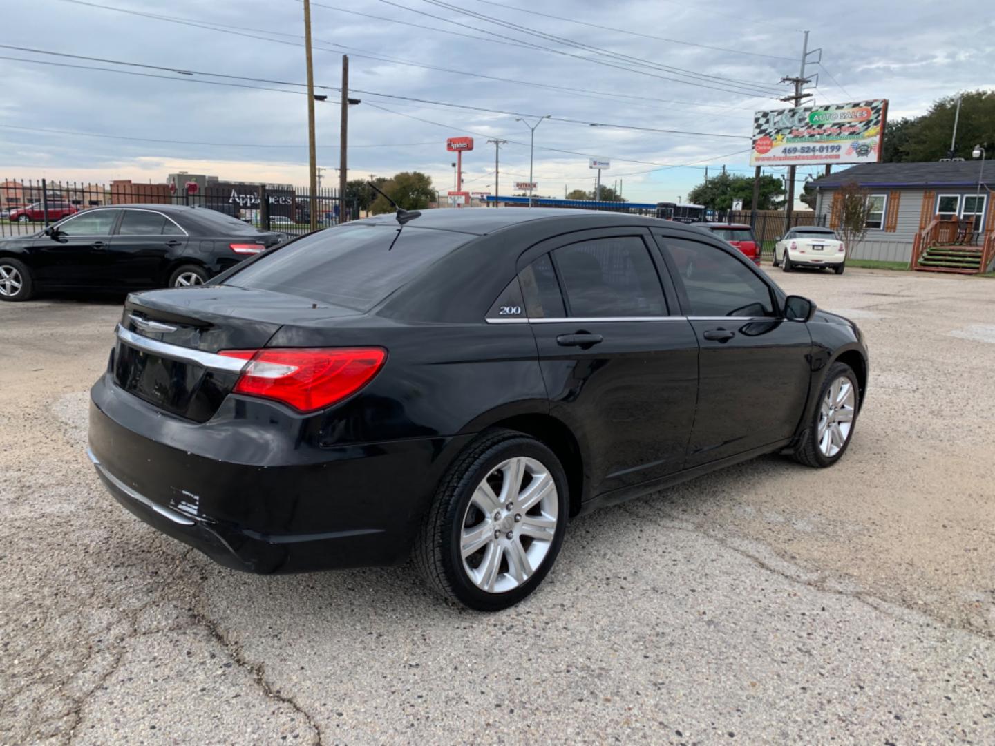 2012 Black /Black Chrysler 200 LX (1C3CCBAB3CN) with an 2.4L L4 DOHC 16V engine, Automatic transmission, located at 1830 North Belt Line Road, Irving, TX, 75061, (469) 524-0199, 32.834373, -96.993584 - Photo#3